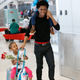 Lilesa carrying his son Sora, and pulling along his daughter, Soko.